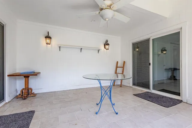 a view of a livingroom with furniture and a chandelier