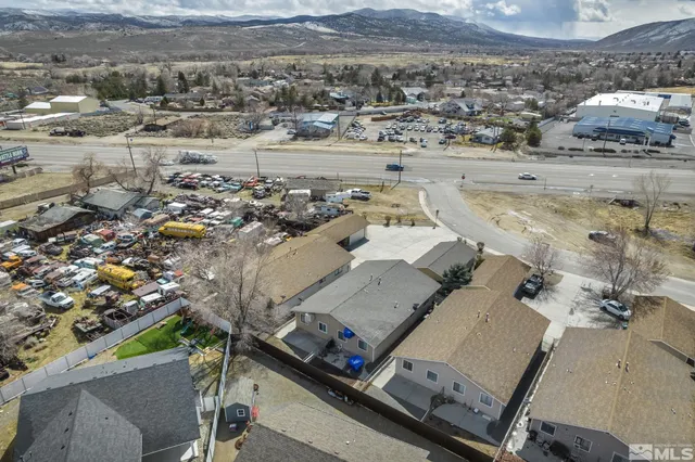 an aerial view of residential houses with outdoor space