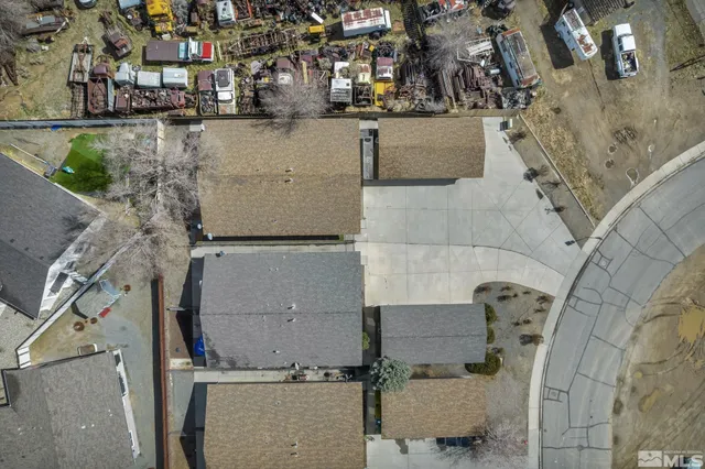 an aerial view of residential houses with outdoor space