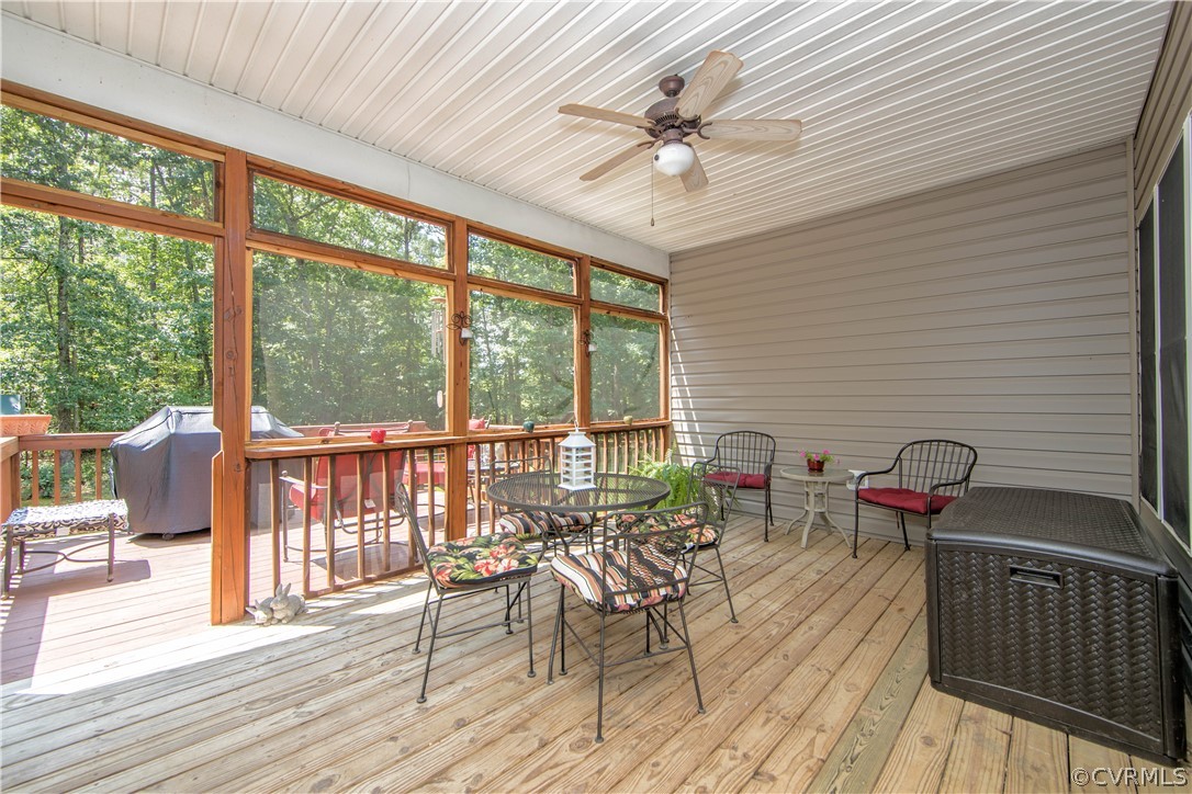 4625 Treely Road Chester, VA 23831 - Photo 19 of 50 a view of a patio with a dining table and chairs