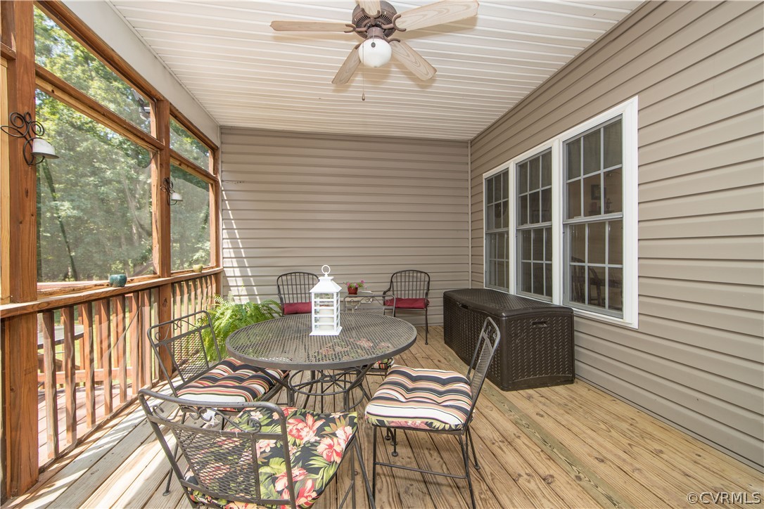 4625 Treely Road Chester, VA 23831 - Photo 20 of 50 a view of a deck with table and chairs and wooden floor