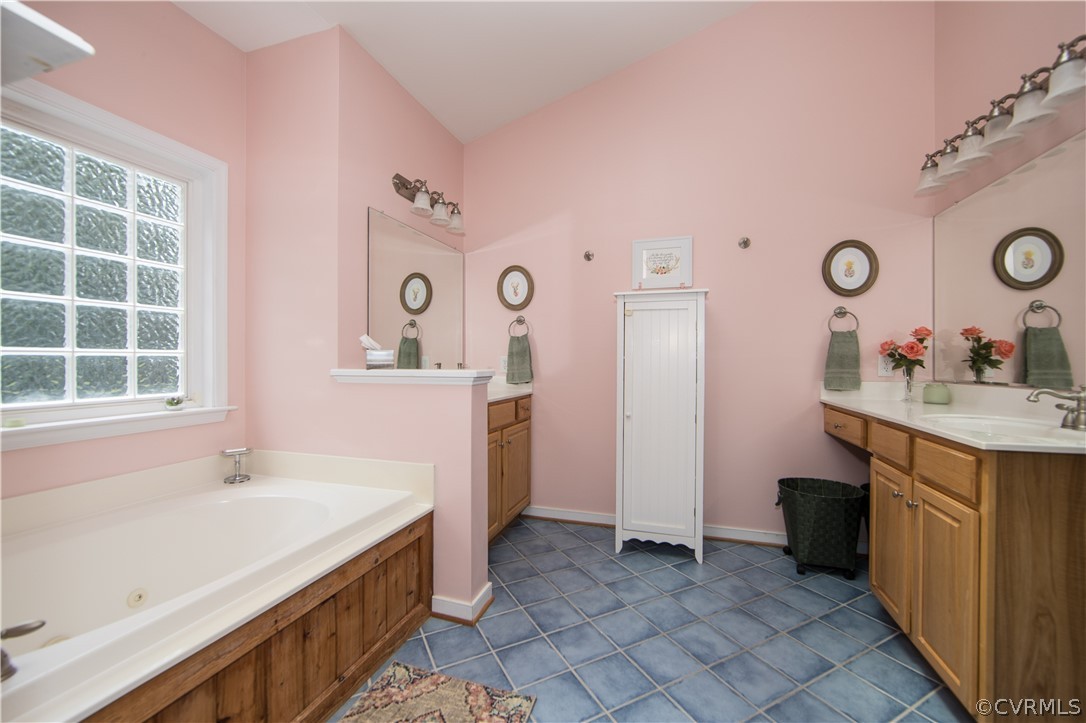 4625 Treely Road Chester, VA 23831 - Photo 37 of 50 a spacious bathroom with a sink and a large mirror
