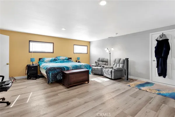 a spacious bathroom with a double vanity sink toilet and shower