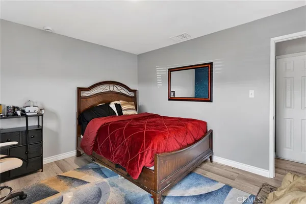 a view of a patio with table and chairs next to a yard