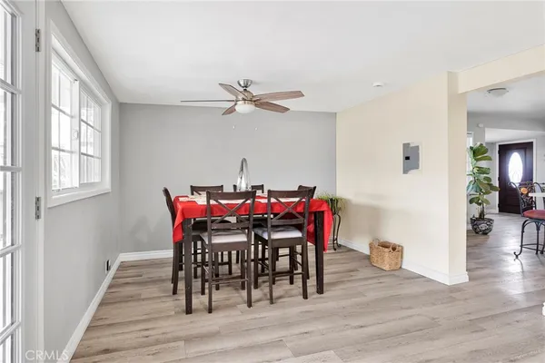 a view of a dining room with furniture and wooden floor