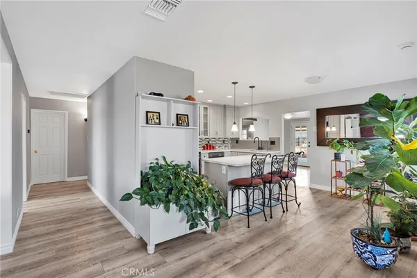 a kitchen with stainless steel appliances granite countertop a refrigerator stove and microwave