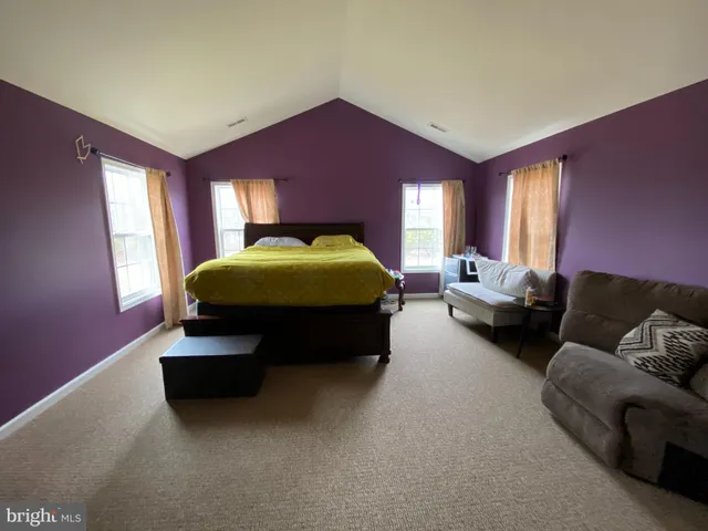 a living room with furniture window and a lamp