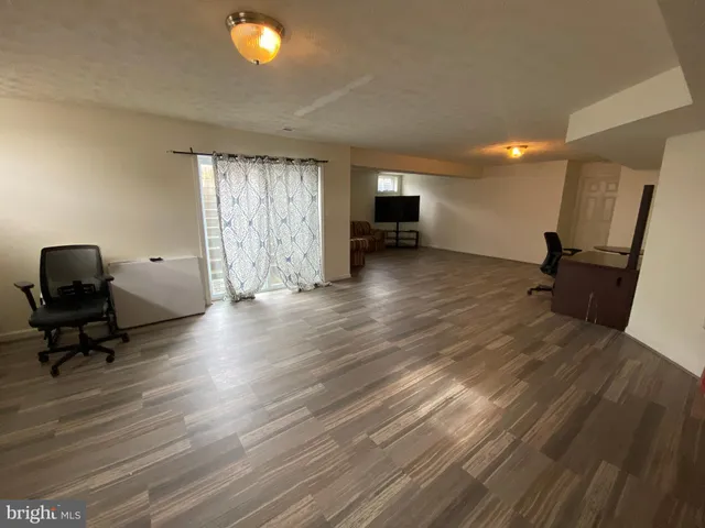 a view of a livingroom with a workspace