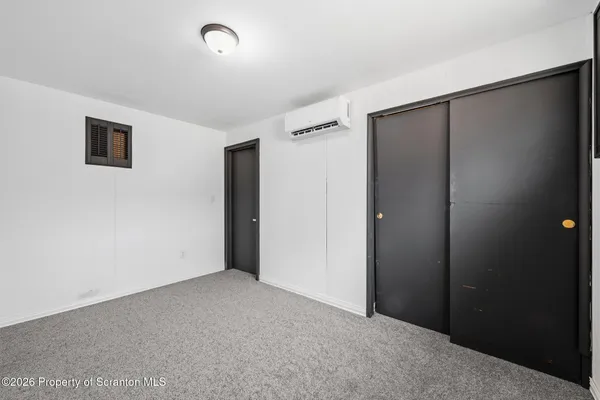a large white kitchen with a sink and dishwasher stove