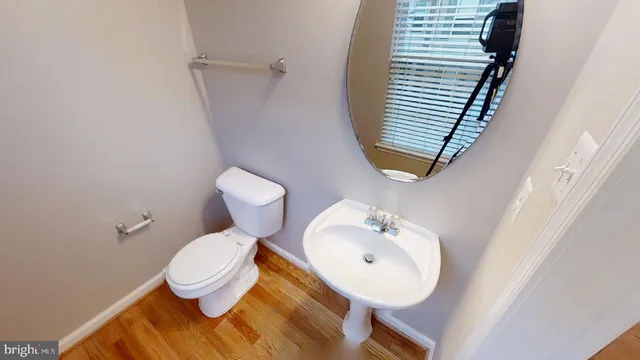 a bathroom with a toilet and a sink