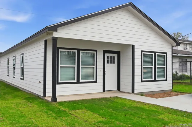 a view of front door and yard