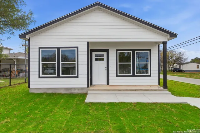 front view of a house with a yard