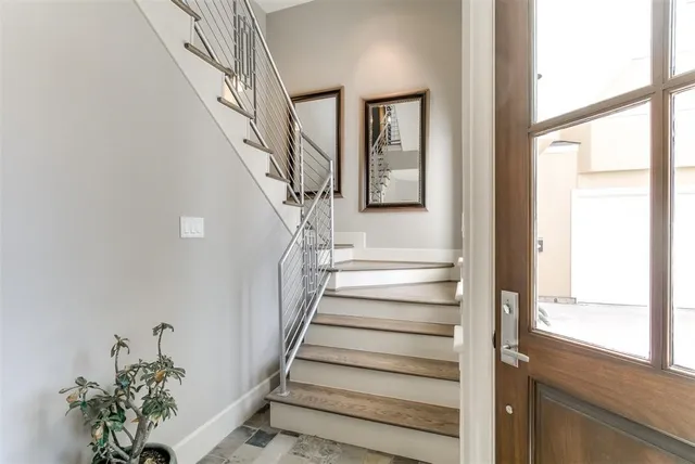 a view of stairs with wooden floor and stairs