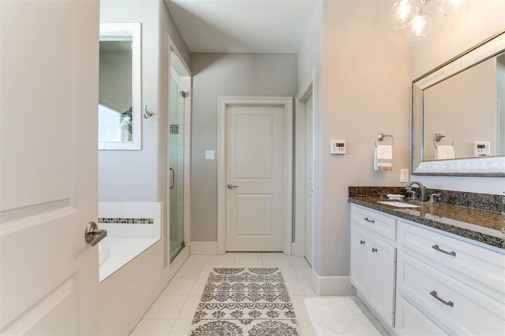 1408 Vermont Street, Unit C Houston, TX 77006 - Photo 16 of 23 a spacious bathroom with a granite countertop tub sink and mirror