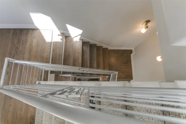 a view of en suite bathroom with toilet sink and mirror