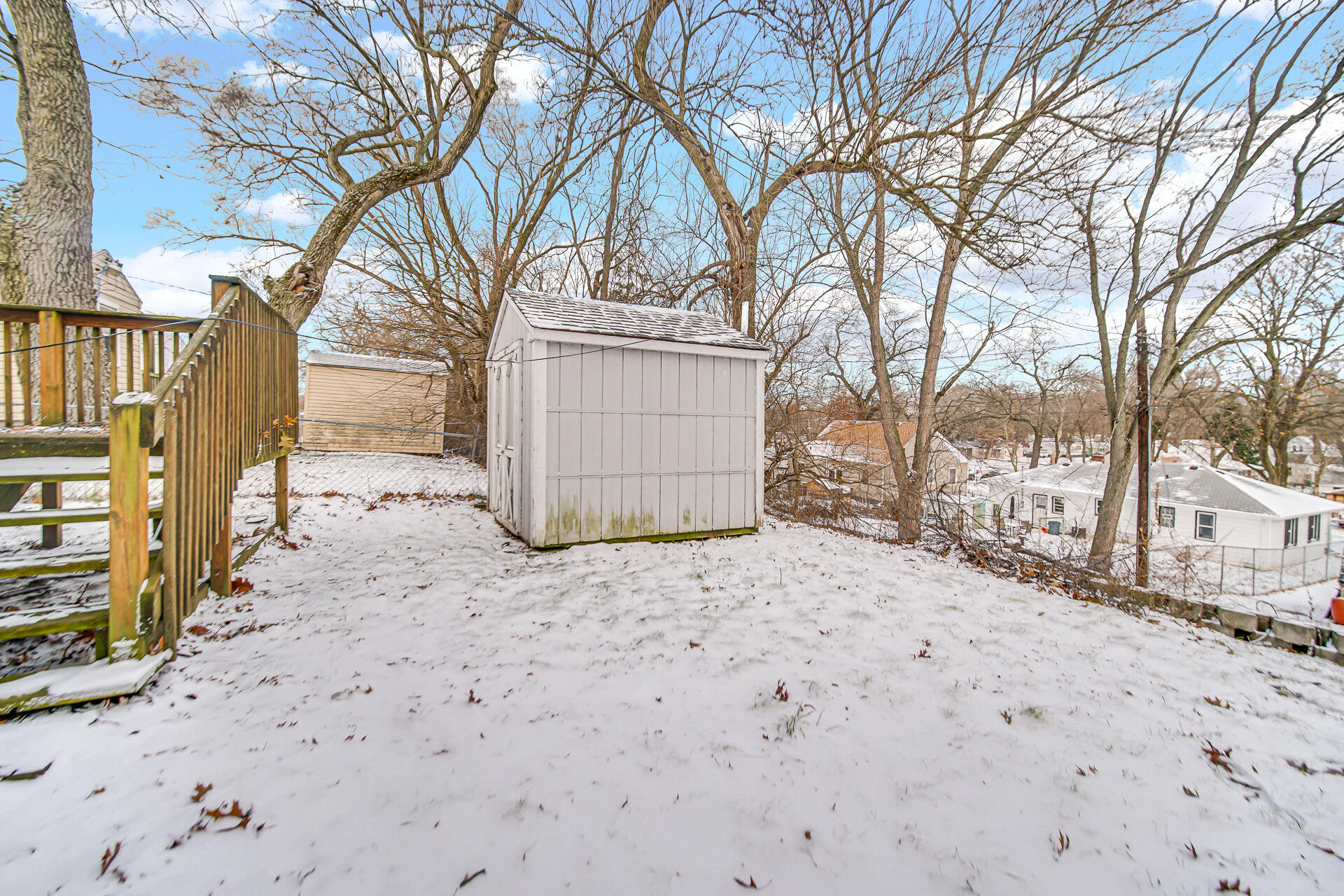 2228 Riverside Drive Lake Station, IN 46405 - Photo 20 of 22 a street view with snow on the road