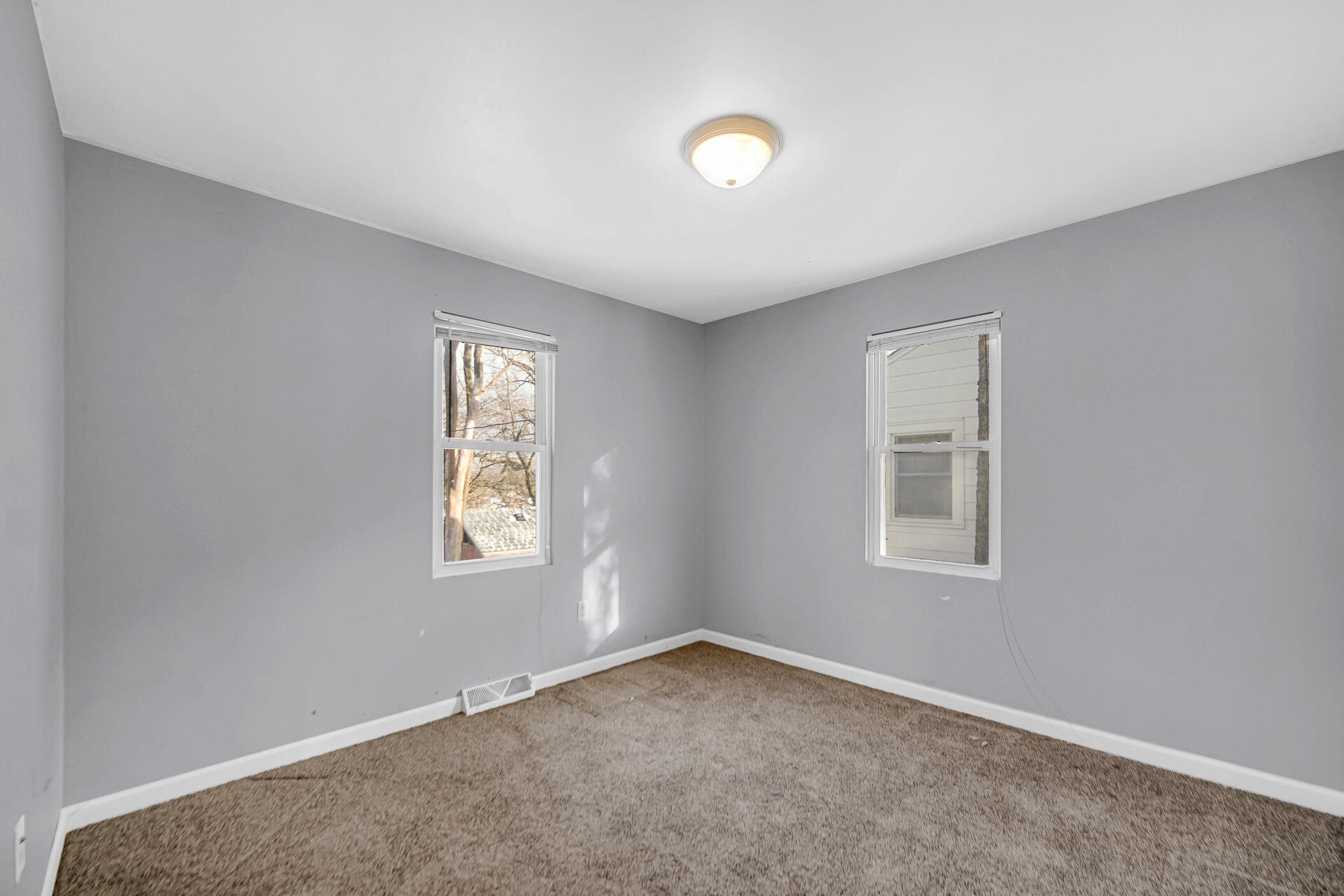 2228 Riverside Drive Lake Station, IN 46405 - Photo 5 of 22 an empty room with windows
