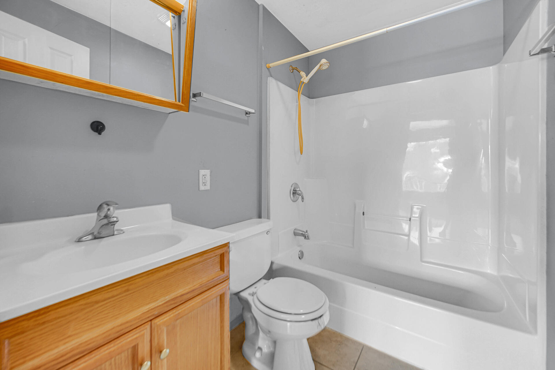 2228 Riverside Drive Lake Station, IN 46405 - Photo 7 of 22 a bathroom with a sink a toilet and shower