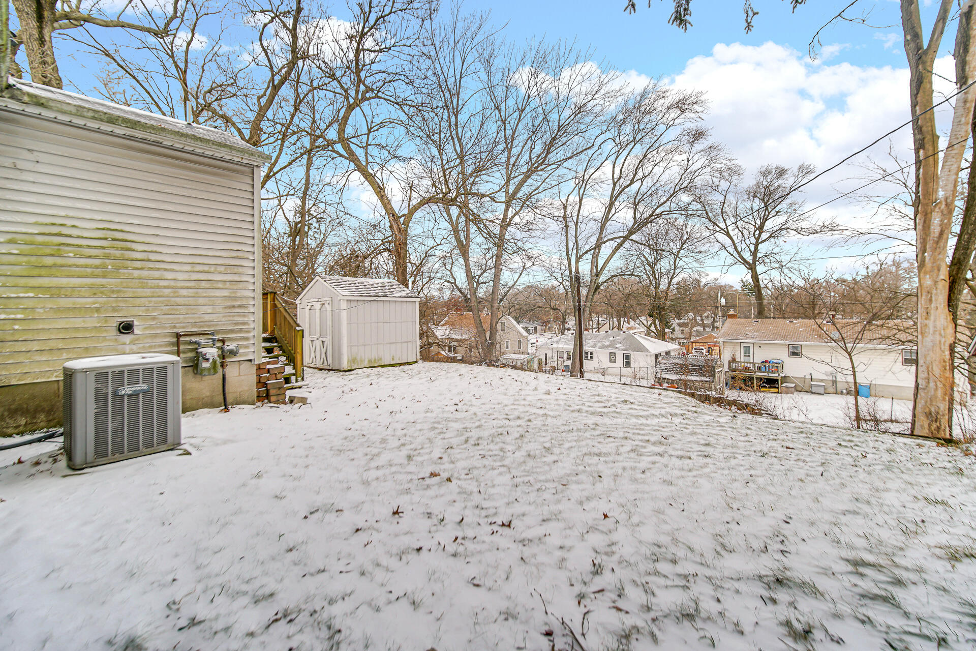 2228 Riverside Drive Lake Station, IN 46405 - Photo 8 of 22 a view of a backyard yard with large trees