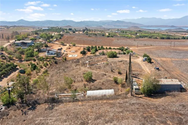 an aerial view of a house with a lake view