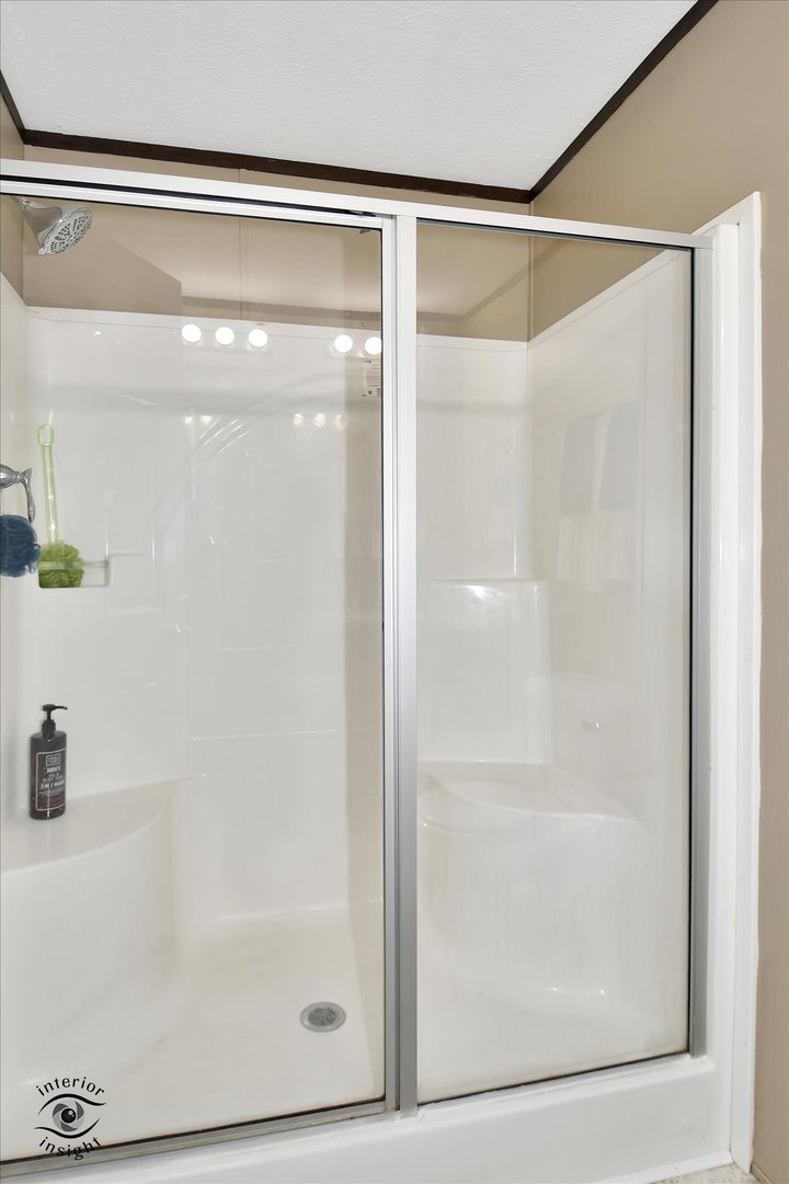 72 Apple Lane Bourbonnais, IL 60914 - Photo 16 of 23 a bathroom with a glass shower door