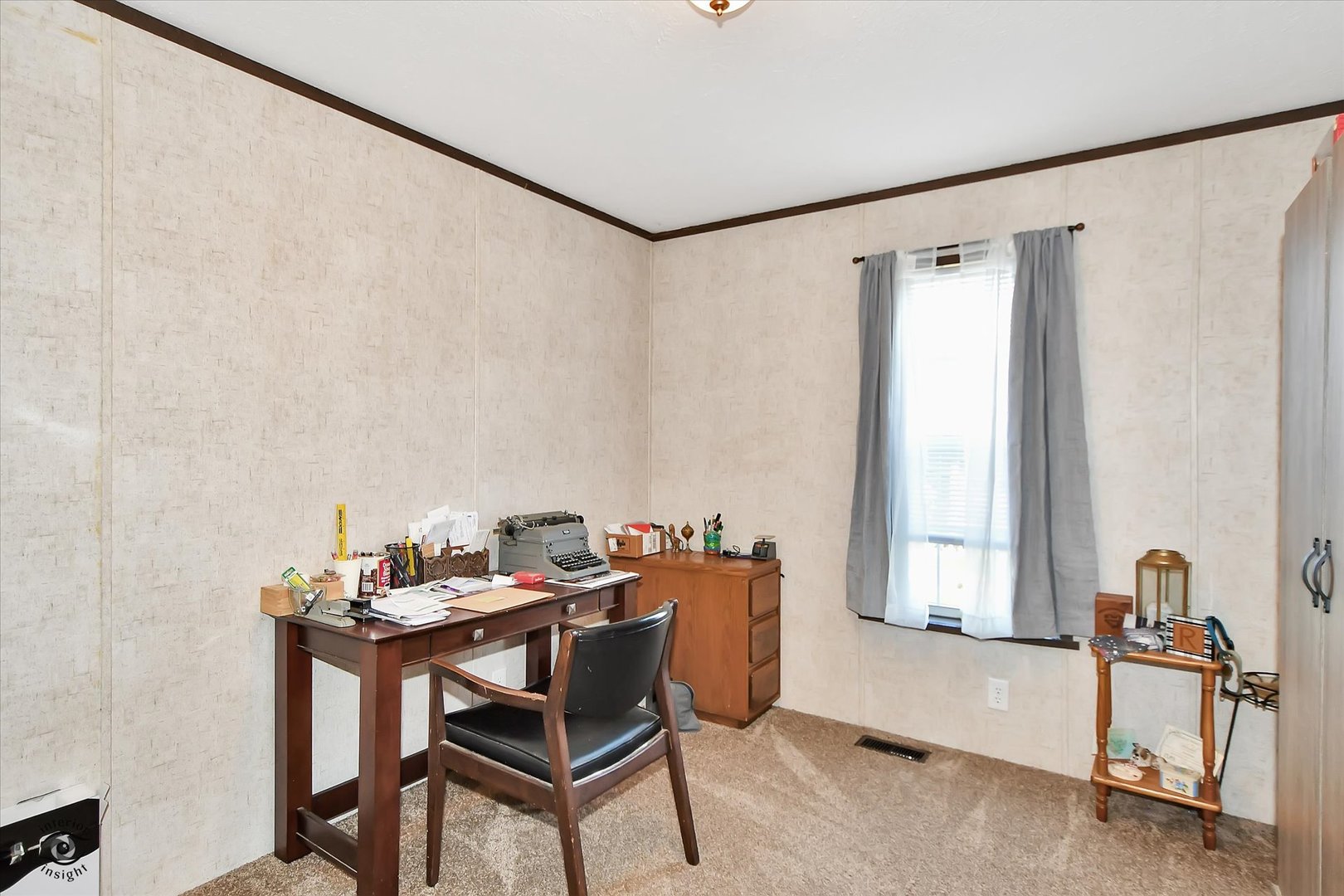 72 Apple Lane Bourbonnais, IL 60914 - Photo 17 of 23 a view of a workspace with furniture and a window