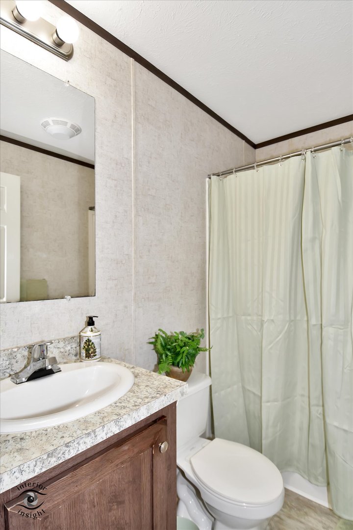 72 Apple Lane Bourbonnais, IL 60914 - Photo 22 of 23 a bathroom with a granite countertop sink and a mirror