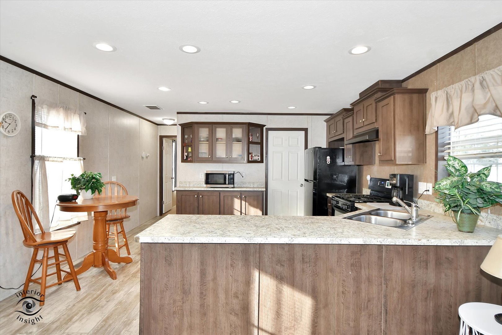 72 Apple Lane Bourbonnais, IL 60914 - Photo 7 of 23 a kitchen with stainless steel appliances kitchen island granite countertop a sink and cabinets
