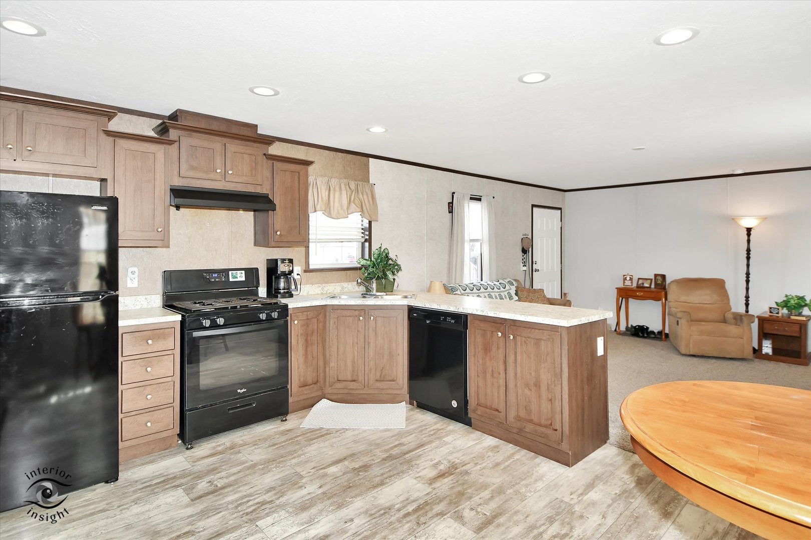 72 Apple Lane Bourbonnais, IL 60914 - Photo 9 of 23 a kitchen with granite countertop a sink stove and refrigerator