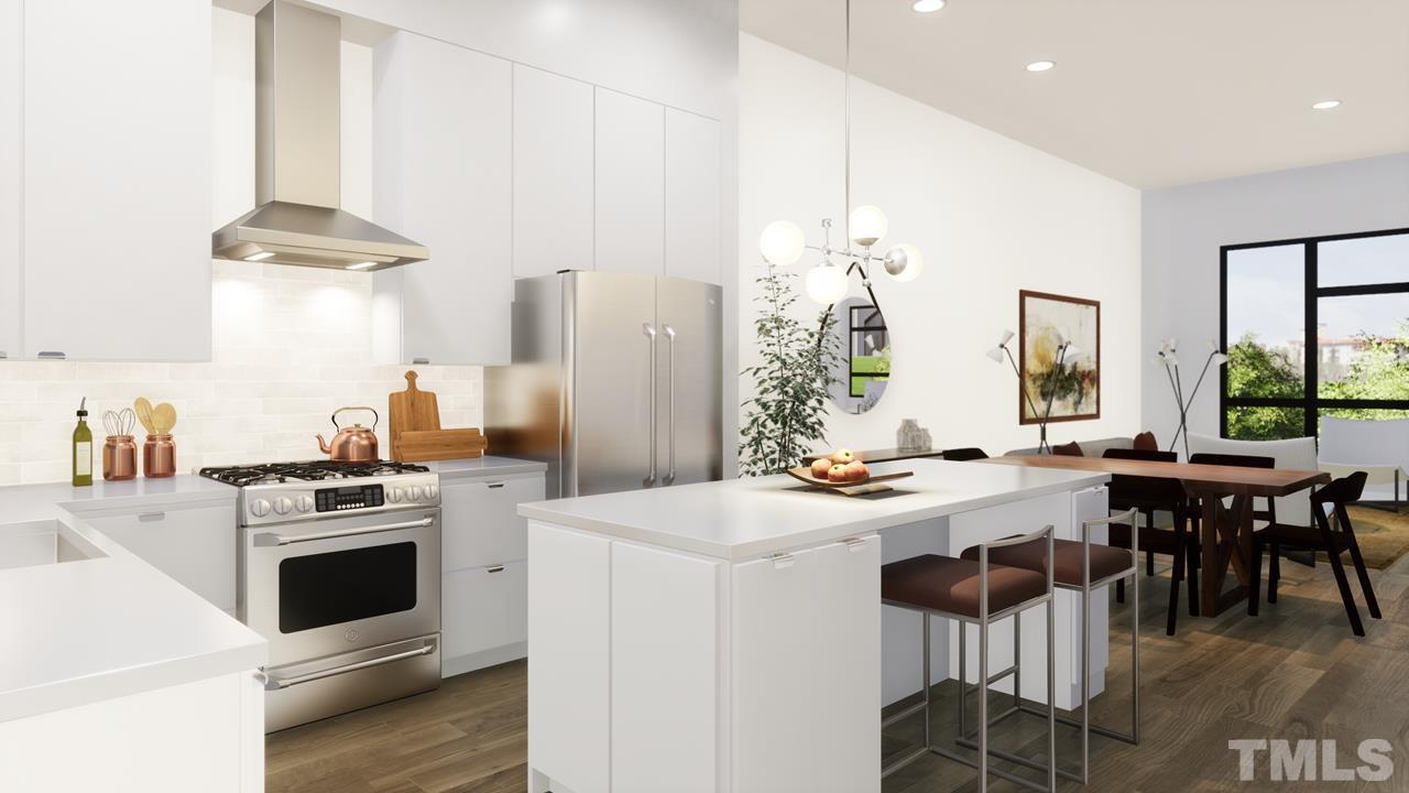 508 North Roxboro Street Durham, NC 27701 - Photo 3 of 20 a kitchen with a stove a table and chairs