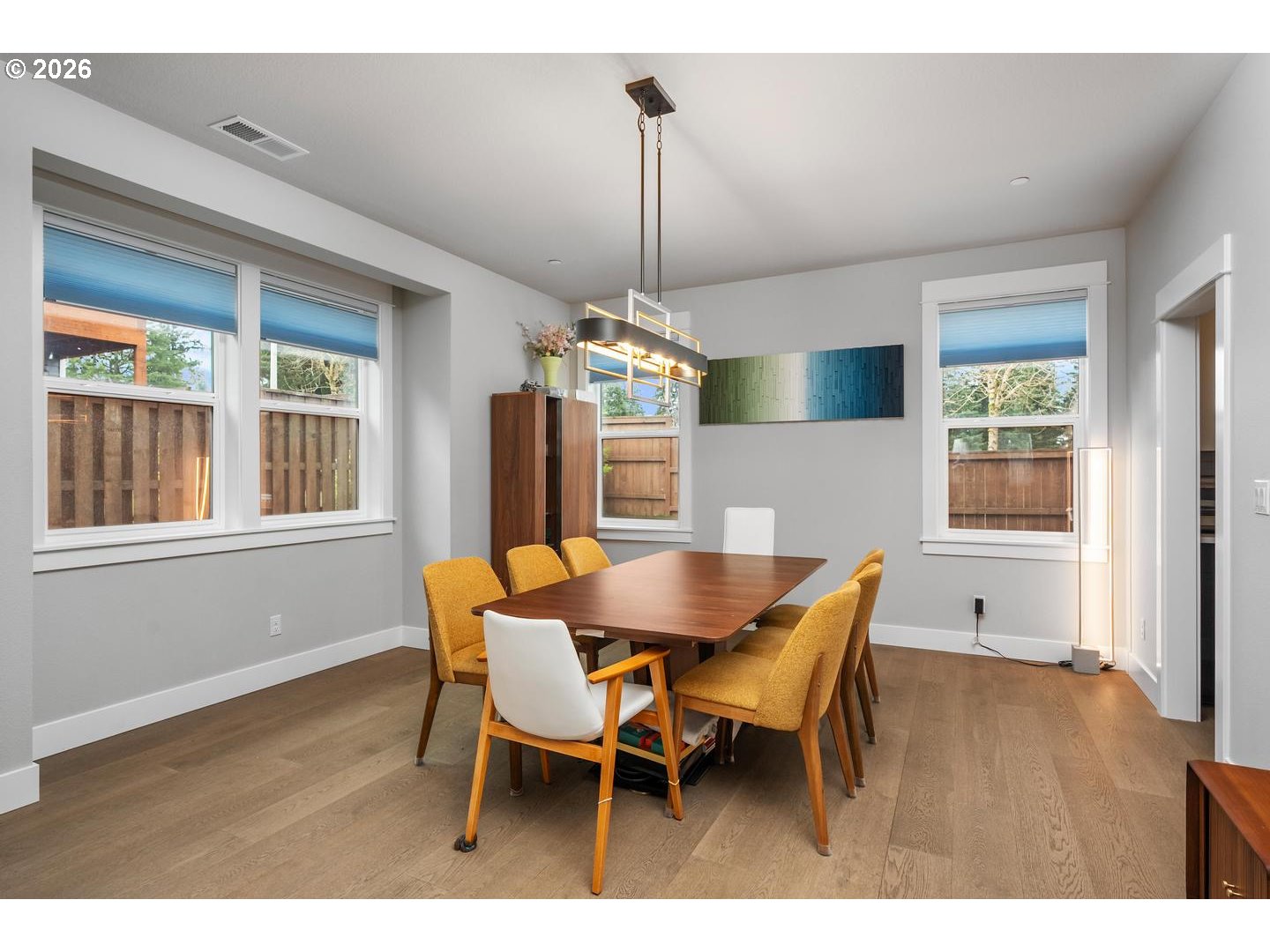 4010 Northwest 62nd Circle Camas, WA 98607 - Photo 14 of 46 a dining room with furniture a chandelier and wooden floor