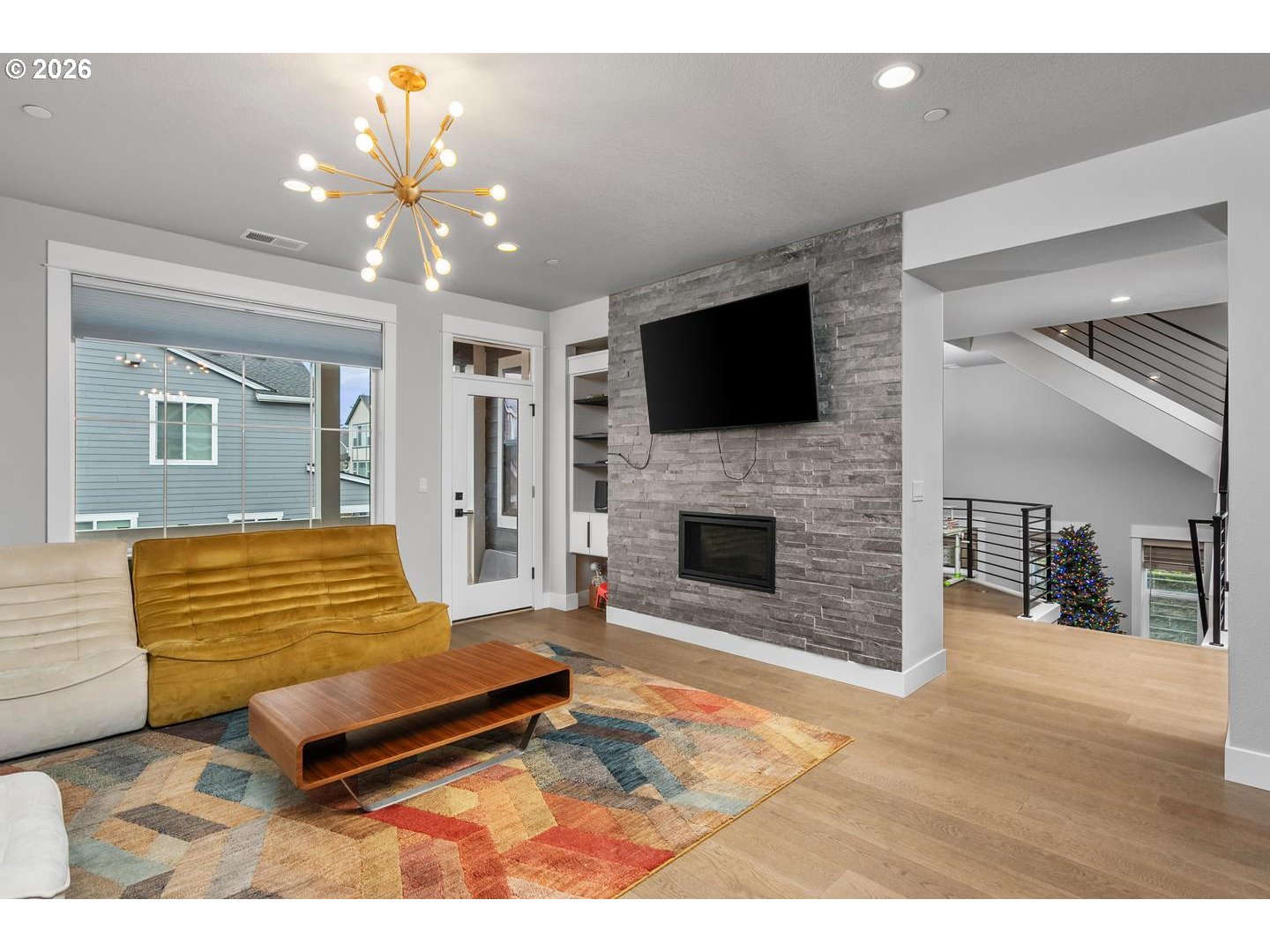 4010 Northwest 62nd Circle Camas, WA 98607 - Photo 4 of 46 a living room with furniture a flat screen tv and kitchen view