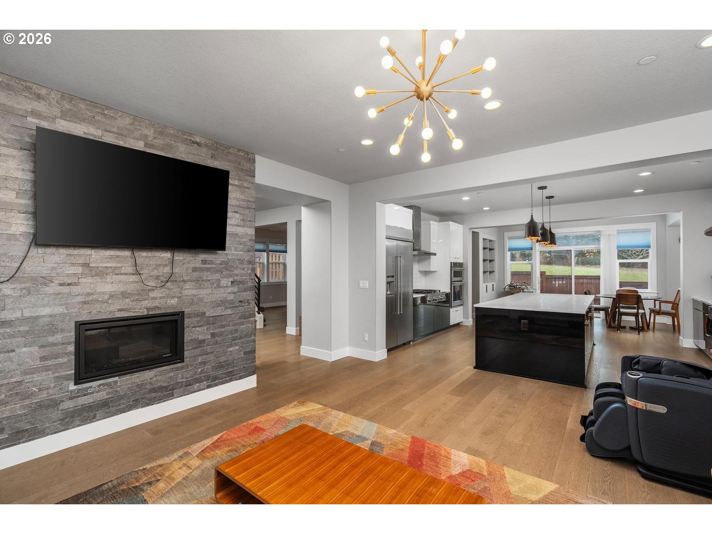 4010 Northwest 62nd Circle Camas, WA 98607 - Photo 6 of 46 a living room with fireplace furniture and a flat screen tv