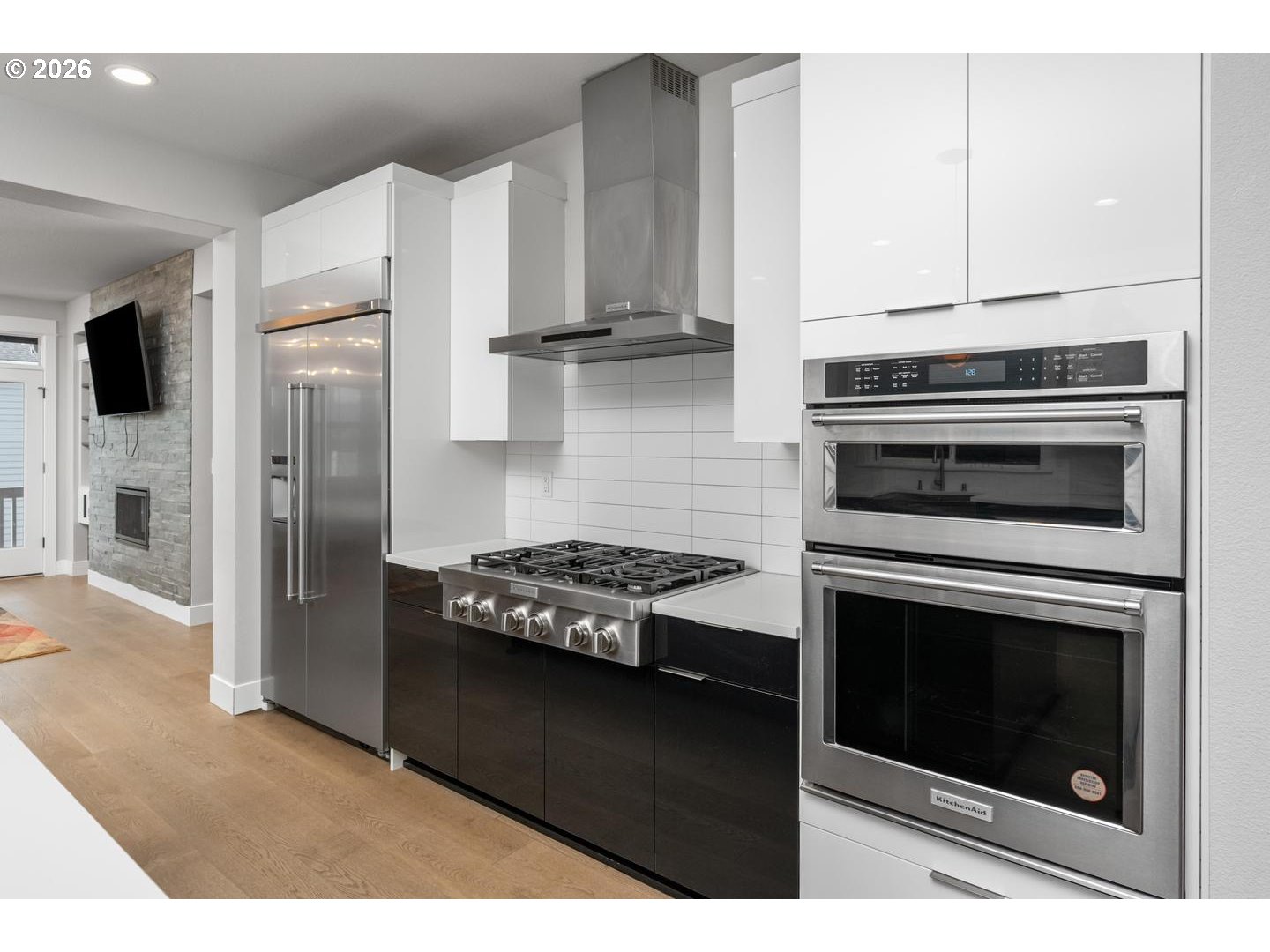 4010 Northwest 62nd Circle Camas, WA 98607 - Photo 10 of 46 a kitchen with stainless steel appliances granite countertop a stove microwave and refrigerator