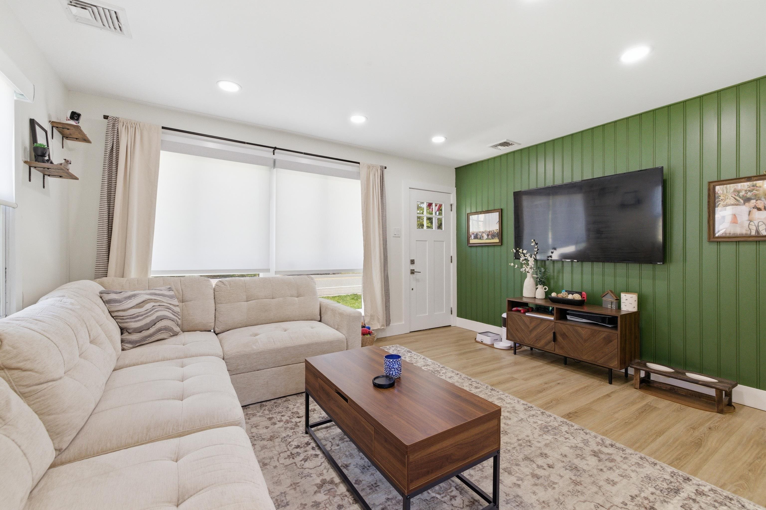209 Breakwater Road North Cape May, NJ 08204 - Photo 15 of 40 a living room with furniture and a flat screen tv