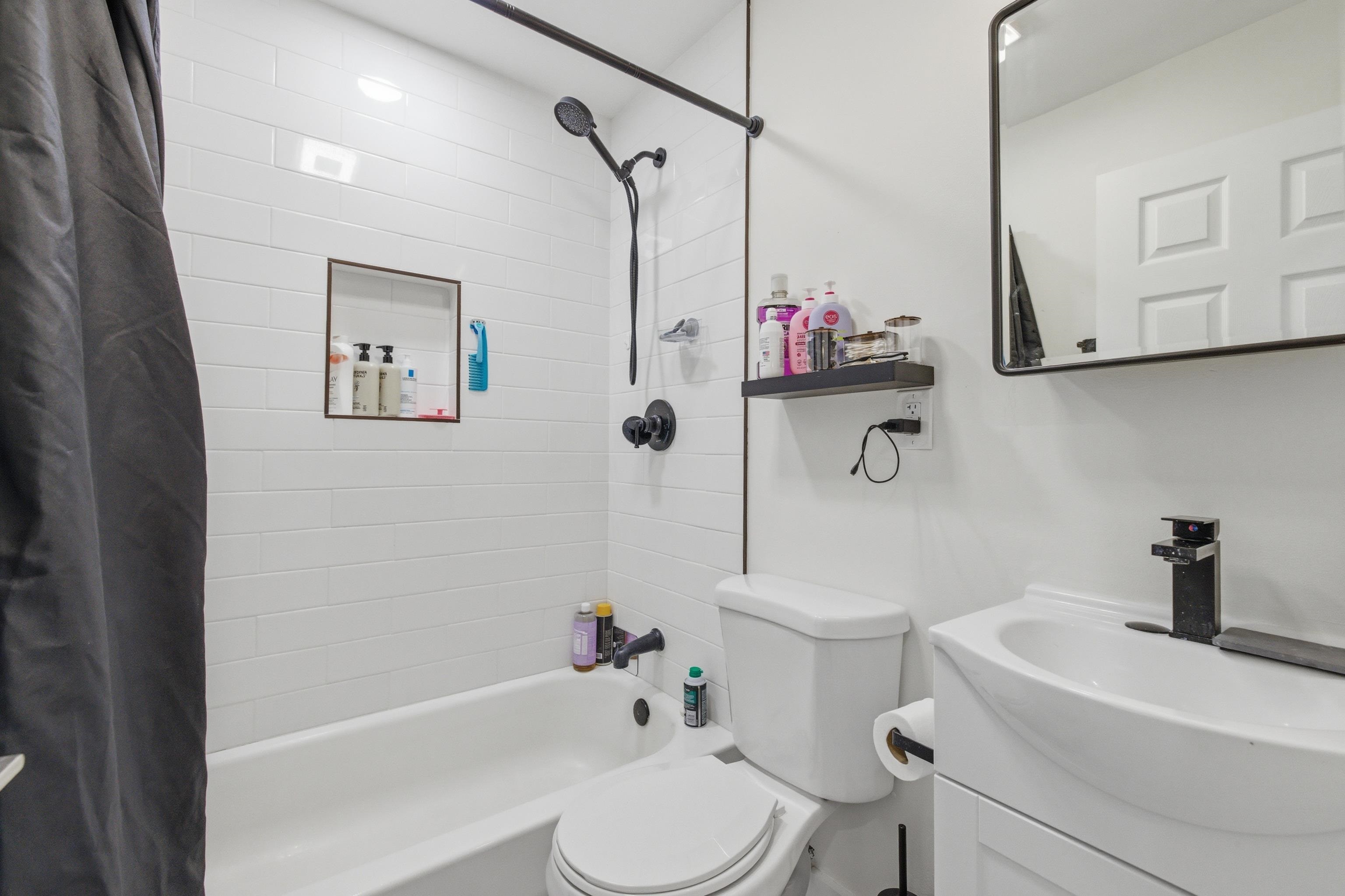209 Breakwater Road North Cape May, NJ 08204 - Photo 17 of 40 a bathroom with a sink a toilet and shower