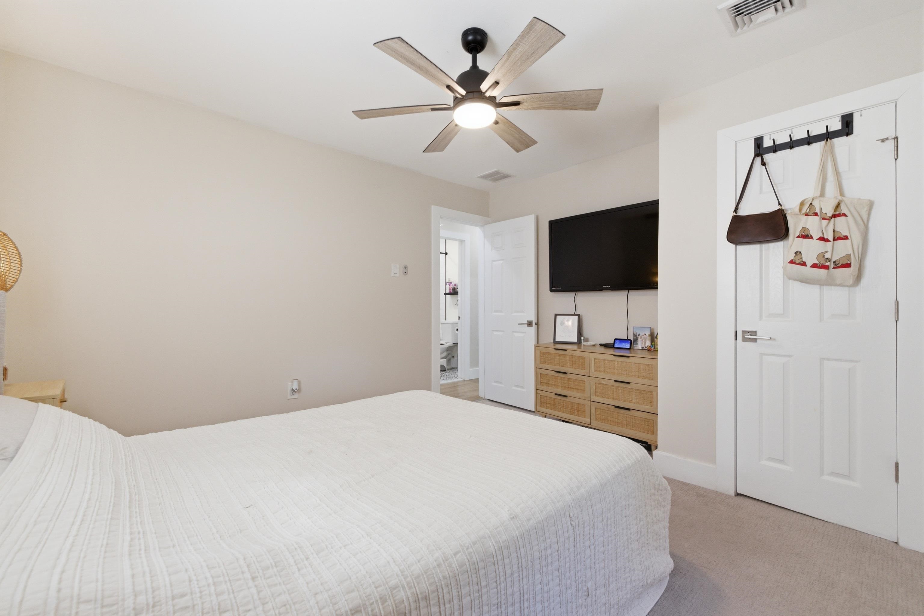 209 Breakwater Road North Cape May, NJ 08204 - Photo 20 of 40 a bedroom with a bed and a flat screen tv