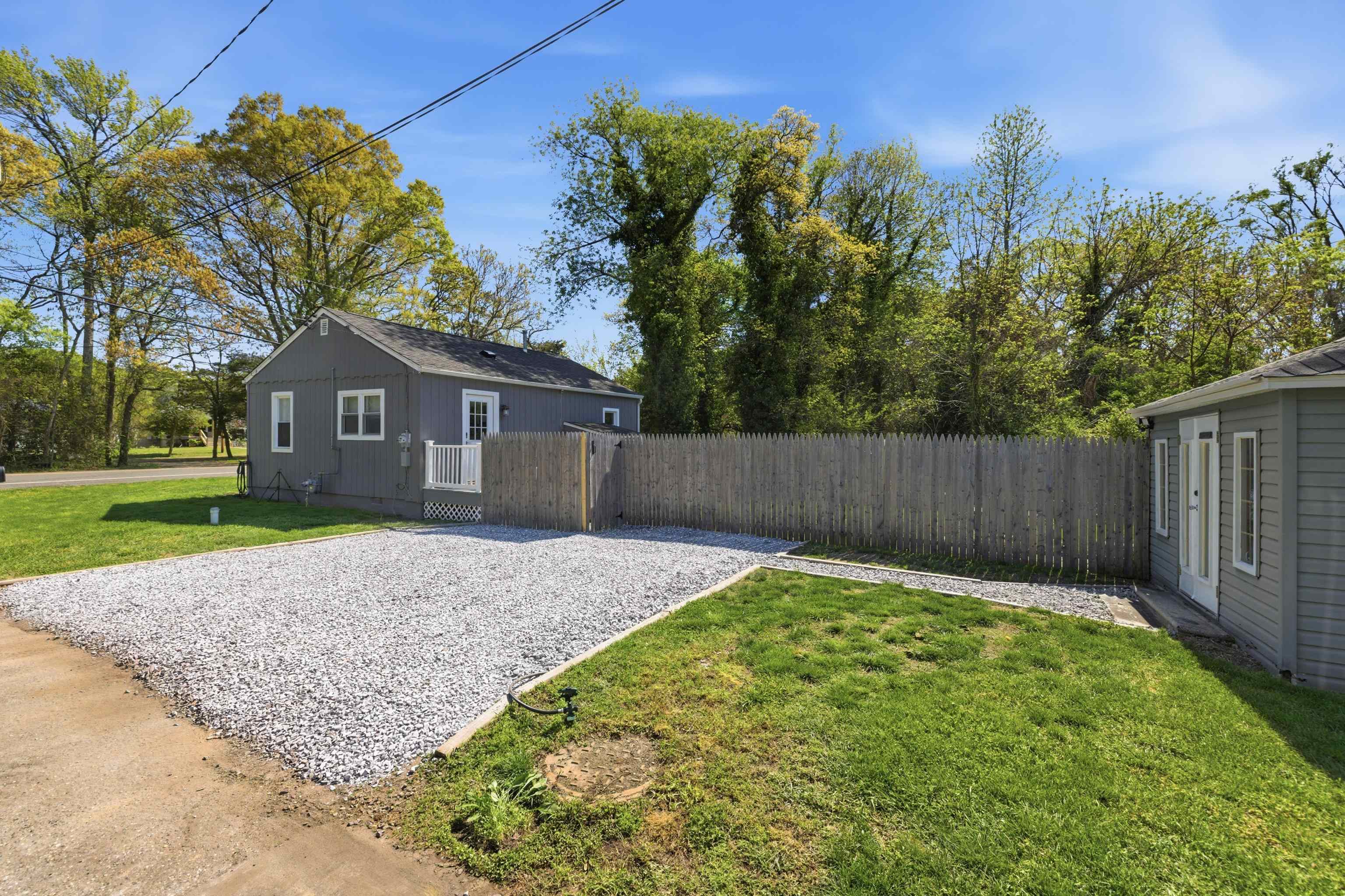 209 Breakwater Road North Cape May, NJ 08204 - Photo 2 of 40 a backyard of a house with lots of green space