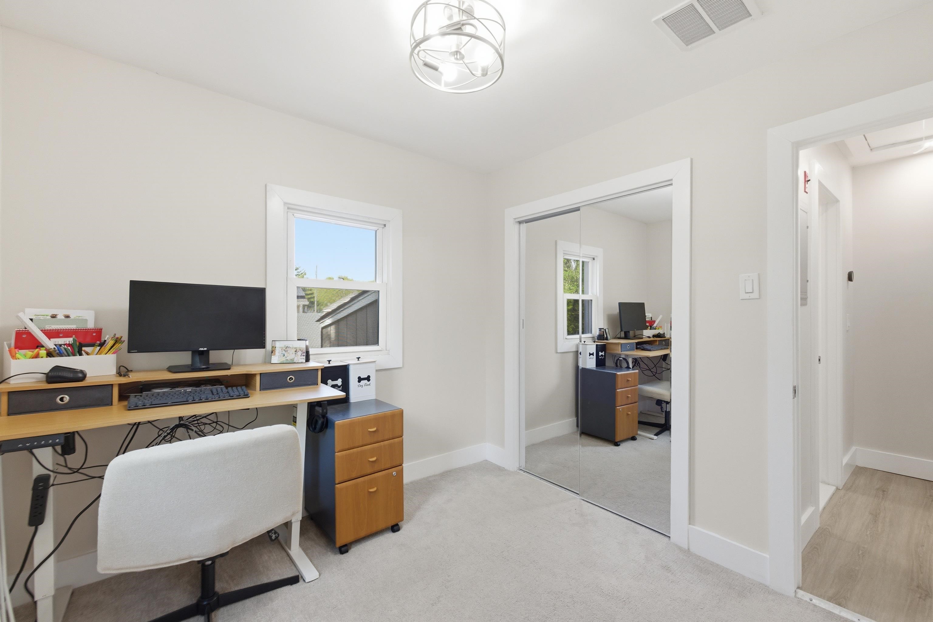 209 Breakwater Road North Cape May, NJ 08204 - Photo 22 of 40 a work room with furniture and a flat screen tv