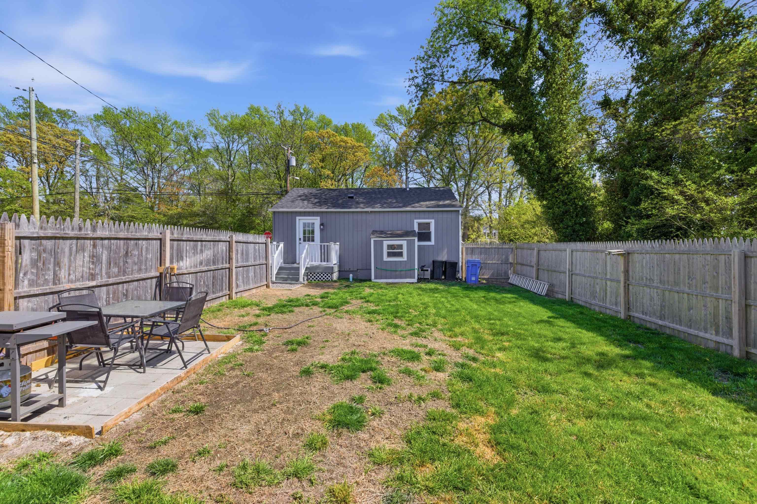 209 Breakwater Road North Cape May, NJ 08204 - Photo 28 of 40 a view of a backyard with a patio