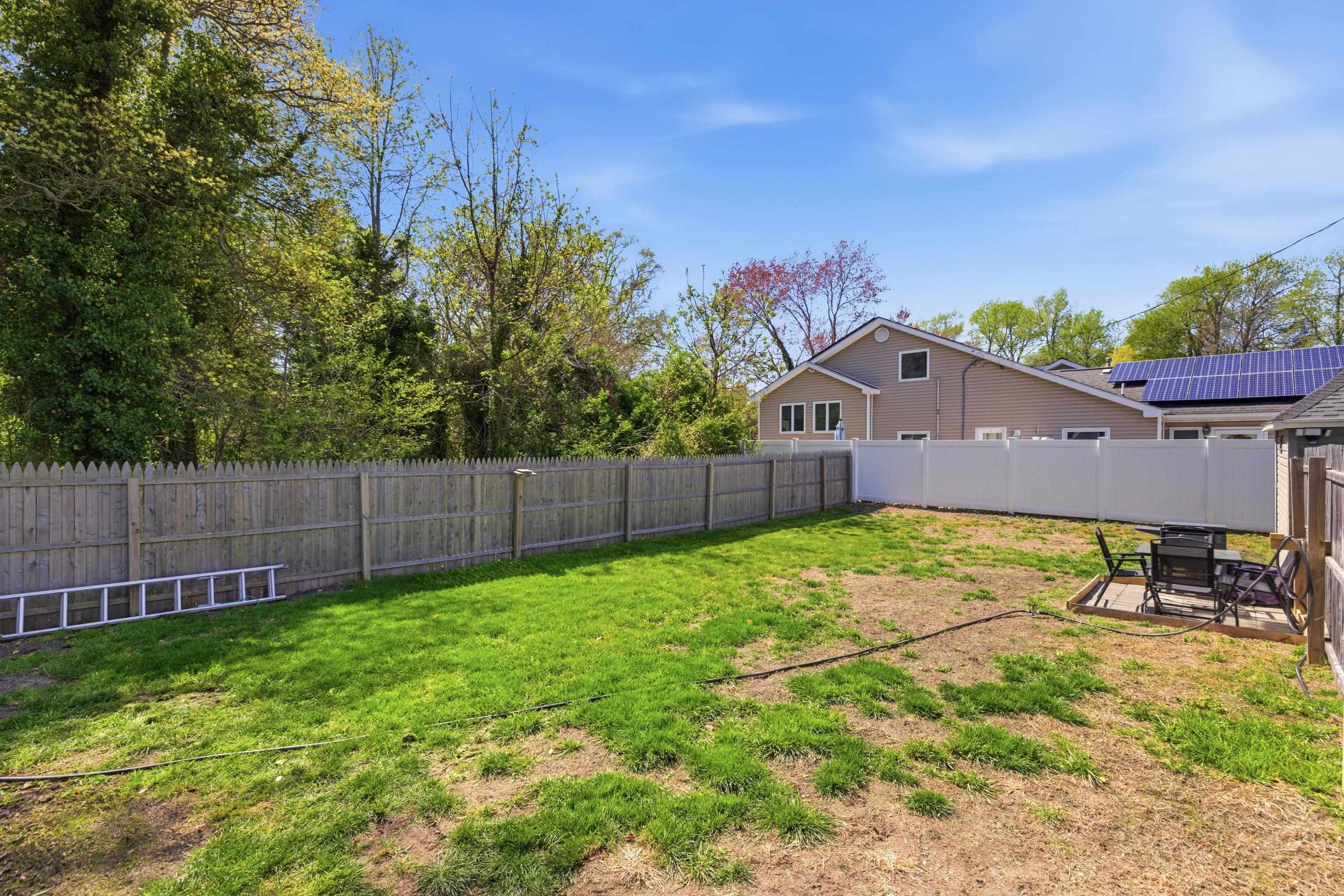 209 Breakwater Road North Cape May, NJ 08204 - Photo 31 of 40 a view of a backyard with a tree