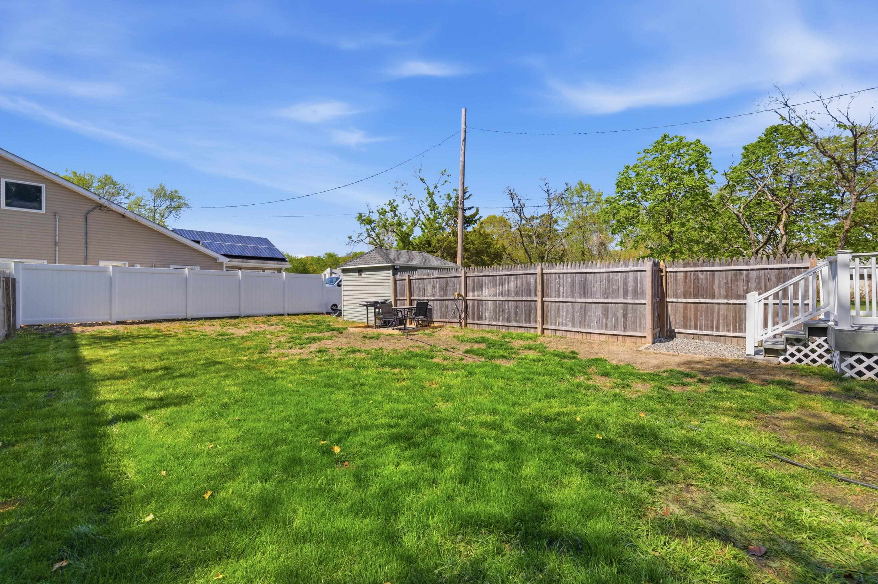 209 Breakwater Road North Cape May, NJ 08204 - Photo 32 of 40 a view of a house with backyard and sitting area