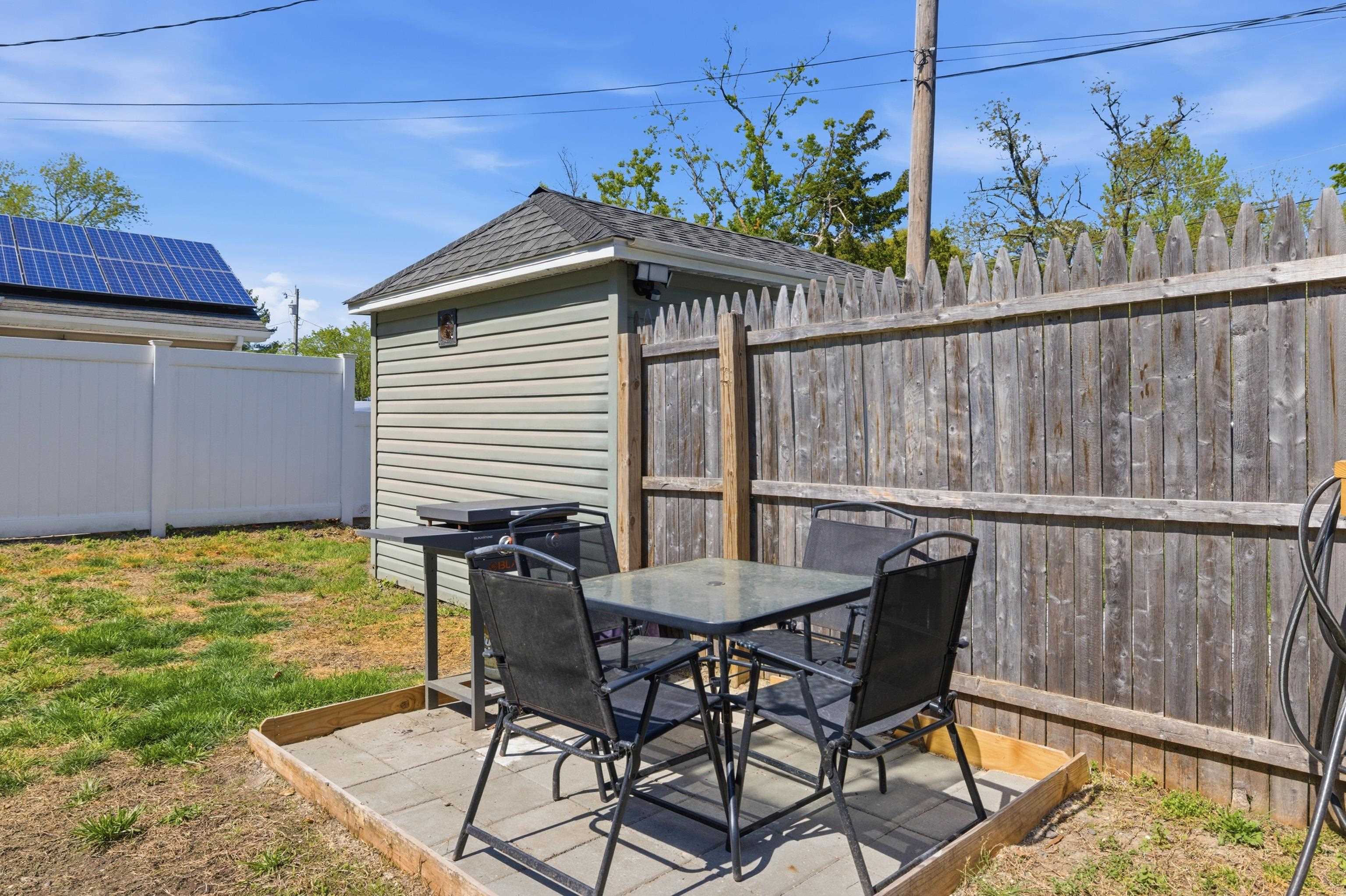 209 Breakwater Road North Cape May, NJ 08204 - Photo 34 of 40 a view of a chairs and table in the patio