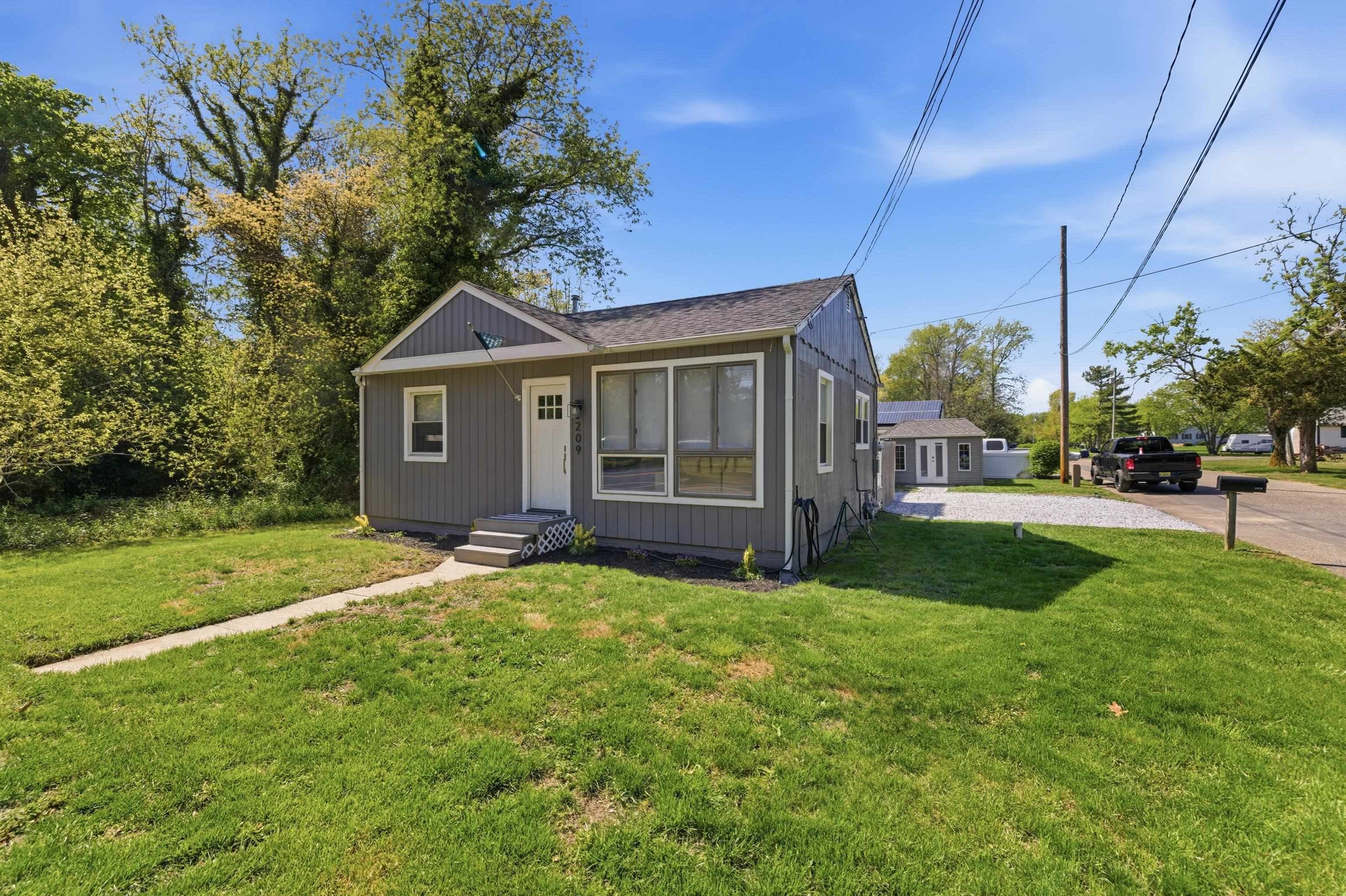 209 Breakwater Road North Cape May, NJ 08204 - Photo 40 of 40 a view of a house with backyard and garden