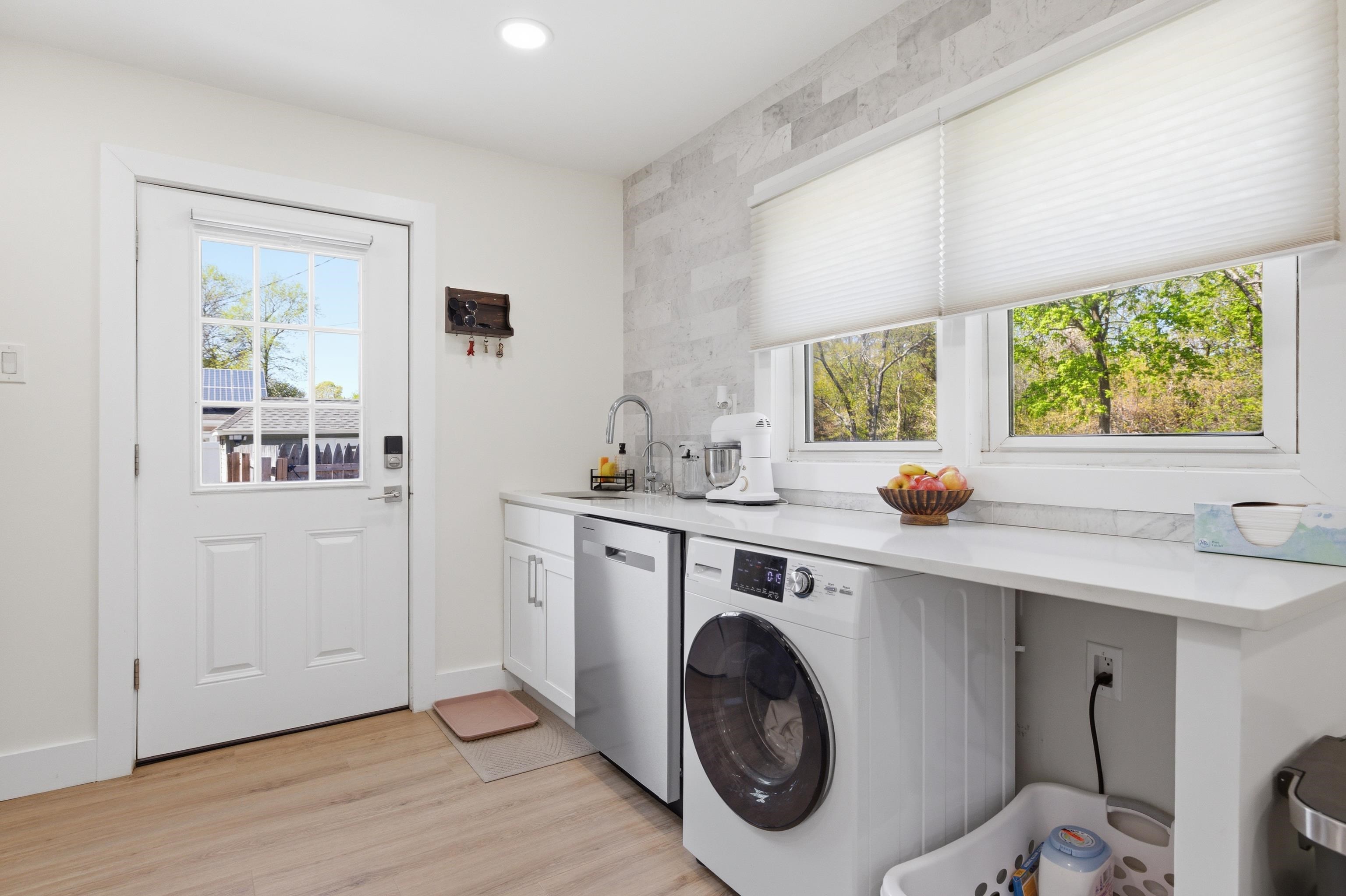209 Breakwater Road North Cape May, NJ 08204 - Photo 7 of 40 a view of a kitchen with washer and dryer