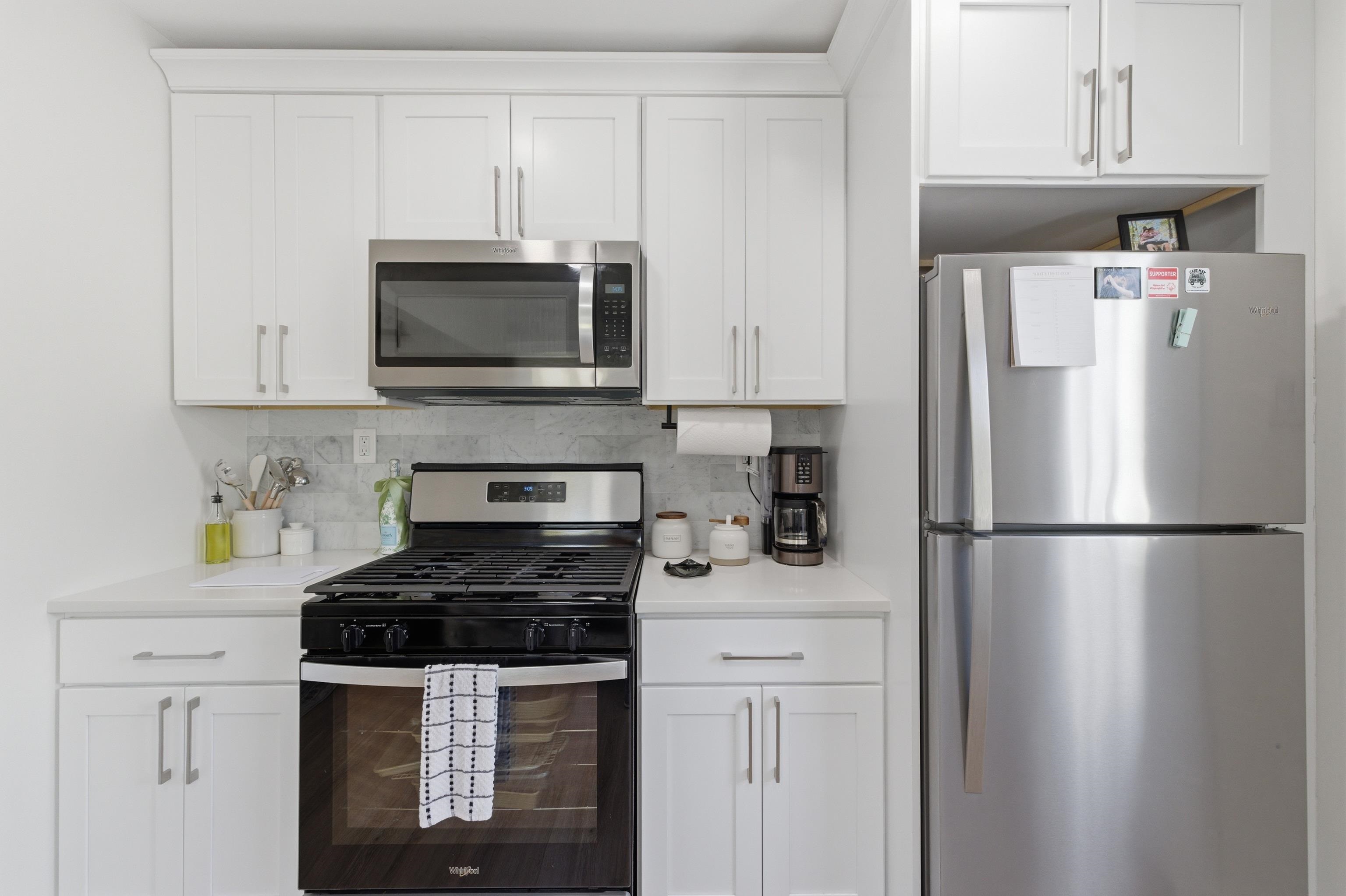 209 Breakwater Road North Cape May, NJ 08204 - Photo 10 of 40 a kitchen with stainless steel appliances a refrigerator stove and microwave