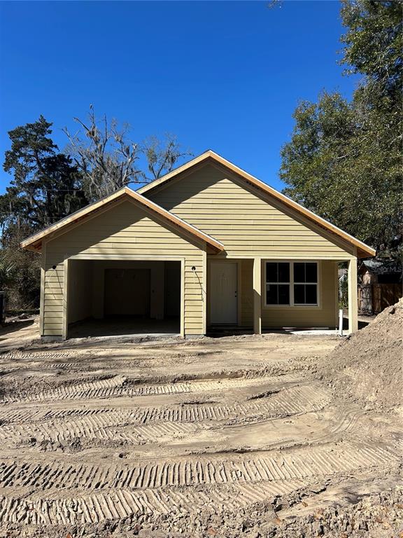2014 Northeast 3rd Place Gainesville, FL 32641 - Photo 2 of 10 a front view of a house with a yard