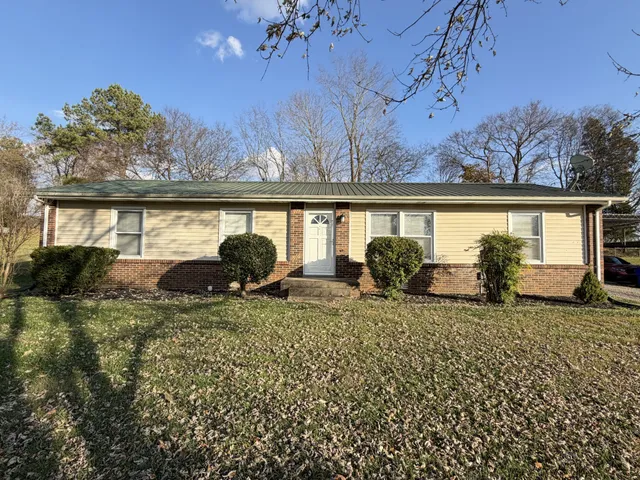 a view of a backyard of the house