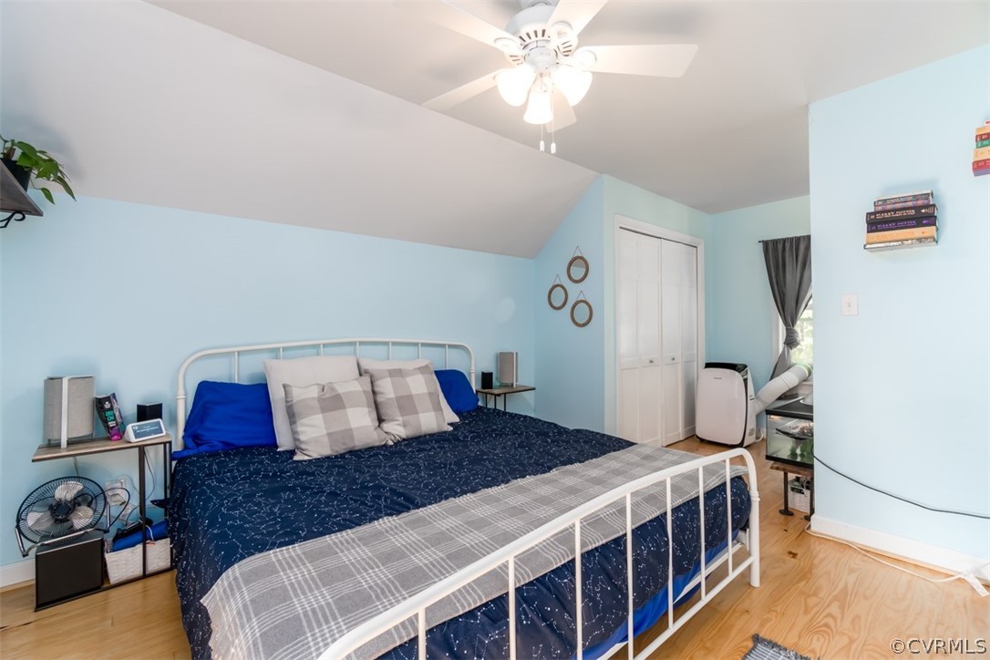 8255 Varina Road Henrico, VA 23231 - Photo 22 of 30 a bedroom with a bed and a chandelier
