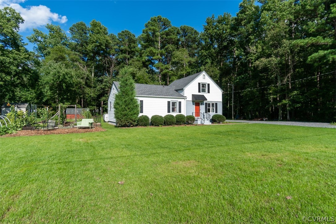 8255 Varina Road Henrico, VA 23231 - Photo 5 of 30 a front view of a house with yard and green space